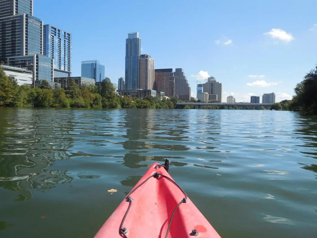 person in a kayak on ladybird lake in austin tx